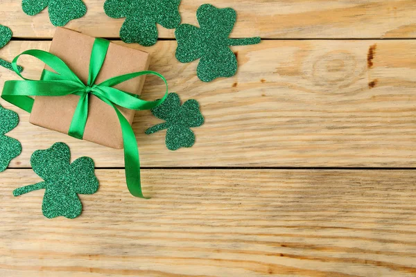 St.Patrick 's Day. Day of rest. Frame of green clover leaves on the natral wooden background. top view. space for text