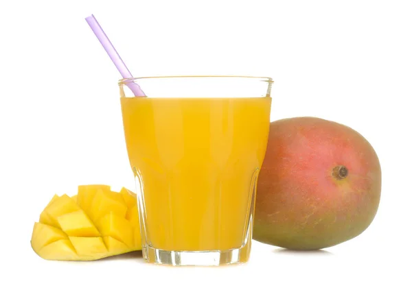 Ripe fresh mango fruit and mango juice in a glass on a white isolated background. tropical fruit
