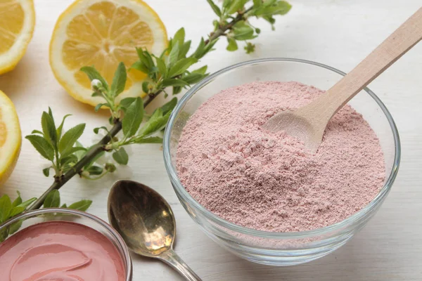 Cosmetic clay. Pink cosmetic clay in different types on a white wooden table. face mask and body. care products. spa.