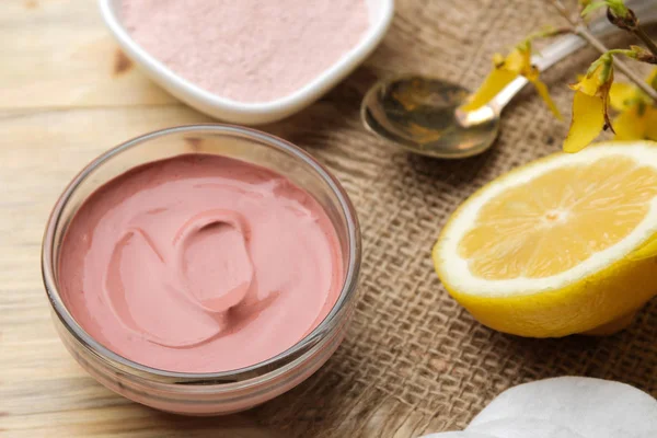 Cosmetic clay. Pink cosmetic clay in different types on a natural wooden table. face mask and body. care products. spa.