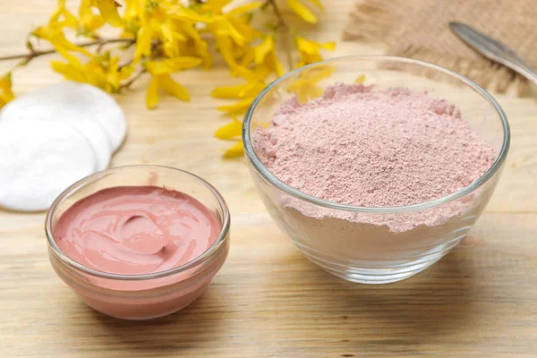 Cosmetic clay. Pink cosmetic clay in different types on a natural wooden table. face mask and body. care products. spa.