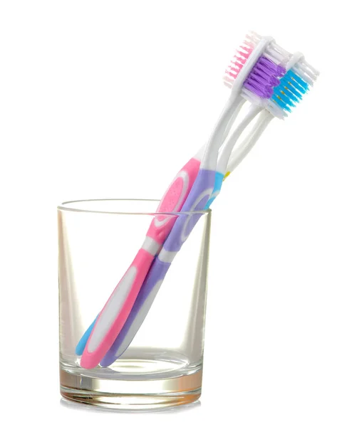 Multi Colored Toothbrushes Glass Beaker White Isolated Background Oral Hygiene — Stock Photo, Image