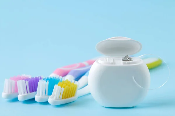 Oral Hygiene Multi Colored Toothbrush Dental Floss Gentle Blue Background — Stock Photo, Image