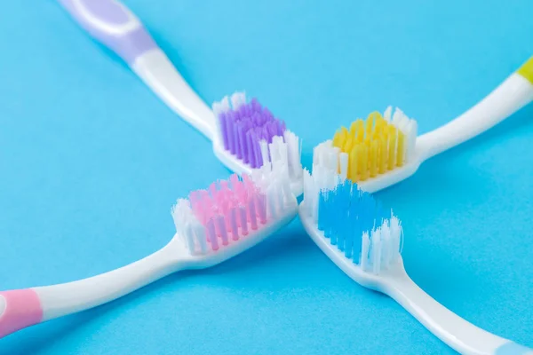 Oral Hygiene Multi Colored Toothbrush Bright Blue Background Close — Stock Photo, Image