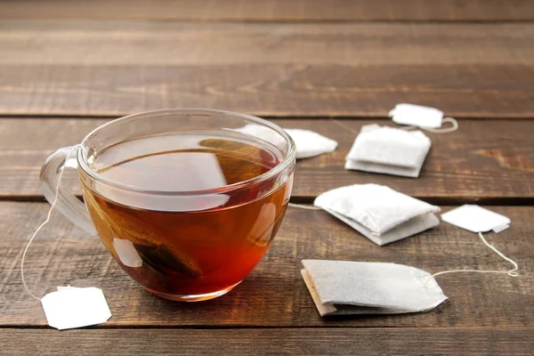 Tea Bag Glass Cup Brown Wooden Background Make Tea — Stock Photo, Image