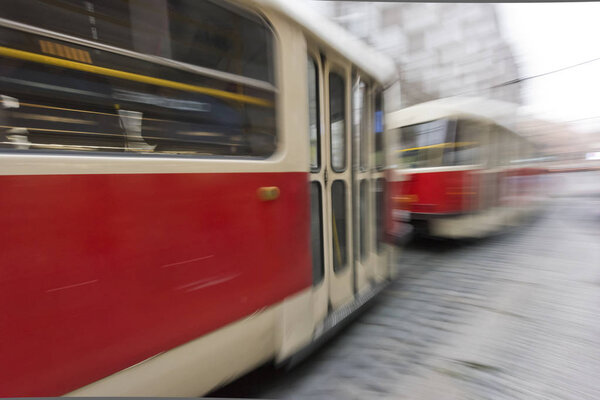 Tram in motion in city