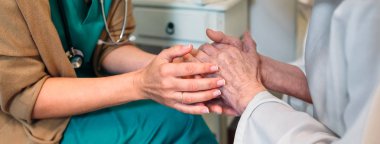 Doctor giving encouragement to elderly patient clipart