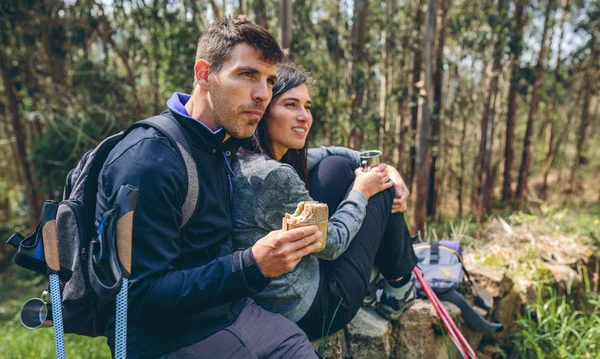 Couple pausing while doing trekking — Stock Photo, Image