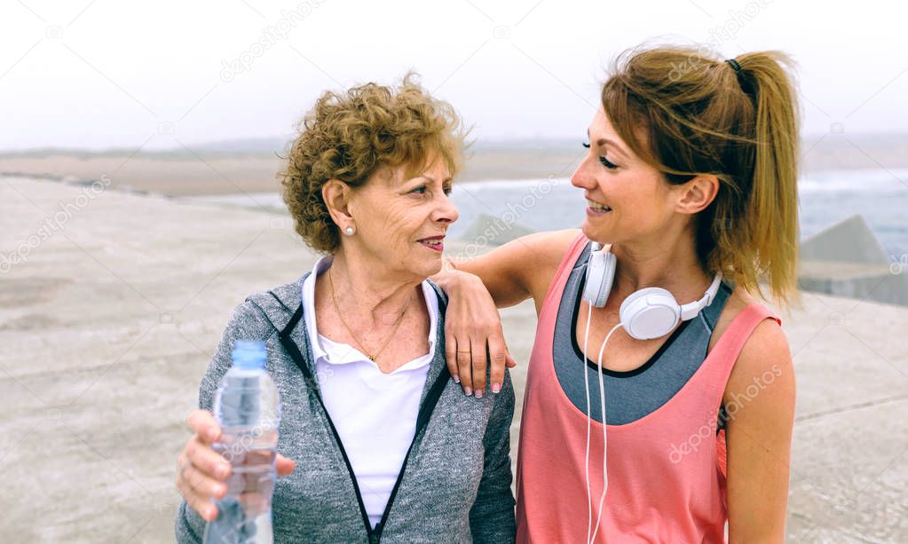 Senior sportswoman talking with female friend