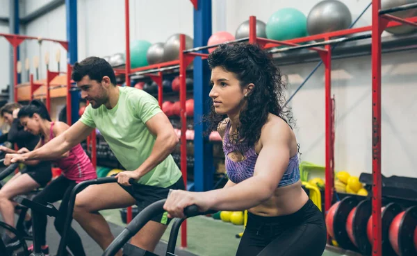 Grupo Atletas Haciendo Bicicleta Neumática Gimnasio —  Fotos de Stock