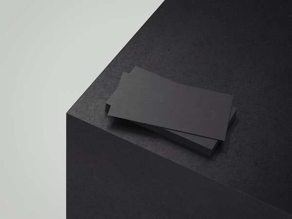 Black business cards on black cube, 3d rendering.