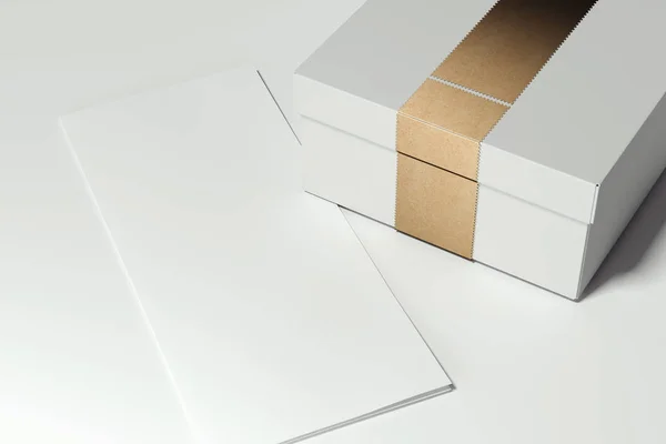 White cardboard box with golden ribbon on white background. 3d rendering. — Stock Photo, Image