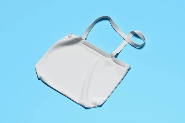 Bolso blanco sobre fondo azul, plantilla para identidad de marca. Renderizado 3D . — Foto de Stock