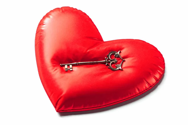Red pillow in the form of heart with retro key above. 3d rendering. — Stock Photo, Image
