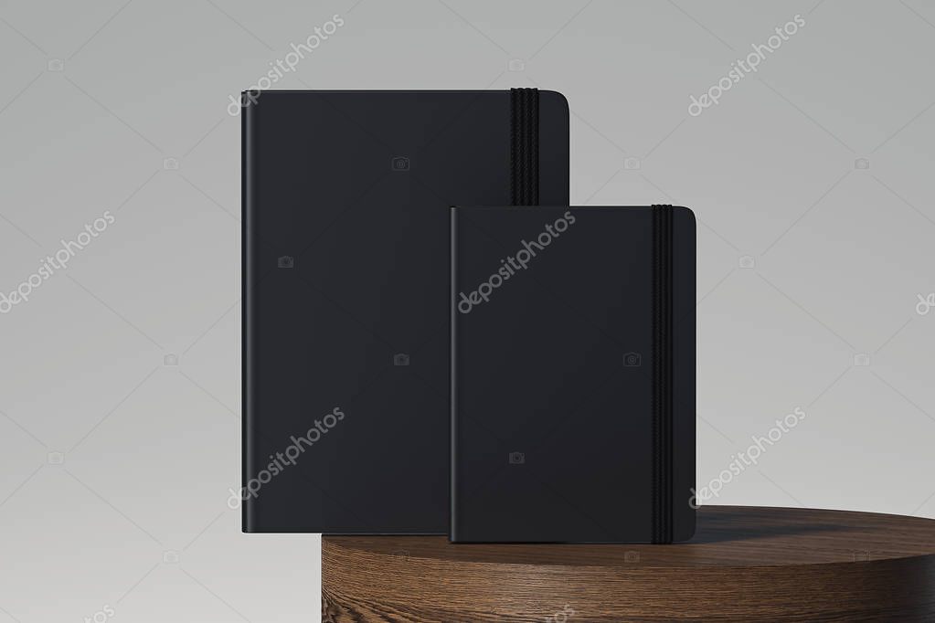 Set of black realistic notepad with black elastic ribbon isolated on light background. 3d rendering.