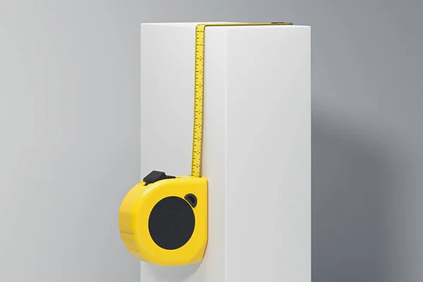 Close up of realistic yellow measure ruler on white cube. 3d rendering, — Stock Photo, Image