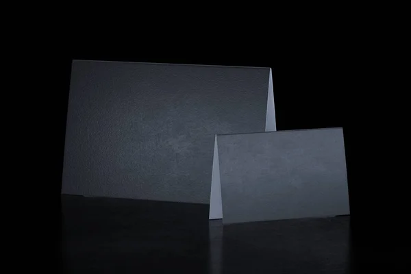 Два чорні порожні складені листівки на чорному тлі. 3D візуалізація . — стокове фото