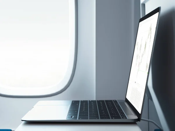 Moderner Laptop im Flugzeuginnenraum mit Fenster im Hintergrund. 3D-Darstellung. — Stockfoto