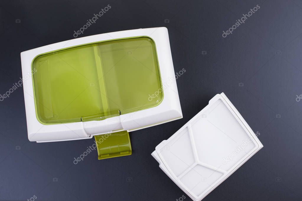 A set of clean plastic lunchboxes. Trend for the office. Black background. New dishes. Copy space.