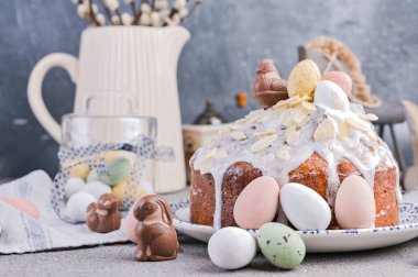Easter orthodox sweet bread, kulich and colorful quail eggs with clipart