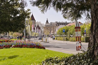 Street Lausanne in the spring and flower beds. Travels in Europe clipart