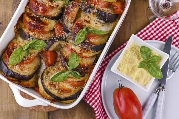 Traditional italian food. Baked eggplant, tomatoes with sauce, p