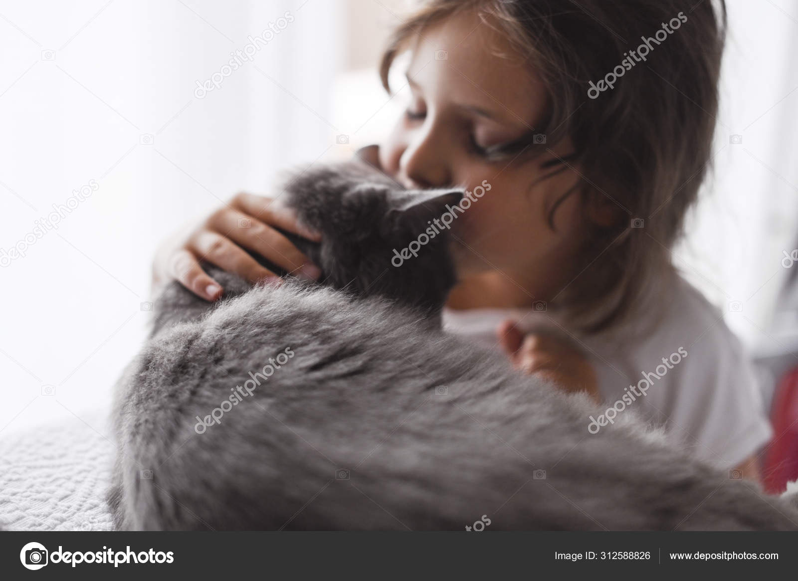 Little girl kisses a cat on the bed in the room. The friendship of people and animals. Relationships and love for pets Stock Photo by ©Marinabakush@ 312588826 Little girl kisses a cat on the bed in the room. The friendship of people and animals. Relationships and love for pets Stock Photo by ©Marinabakush@ 312588826
