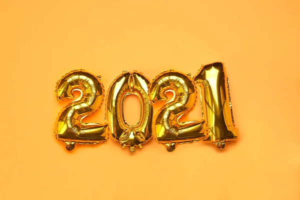 Happy New year 2021 celebration. Gold and silver foil balloons numeral 2021