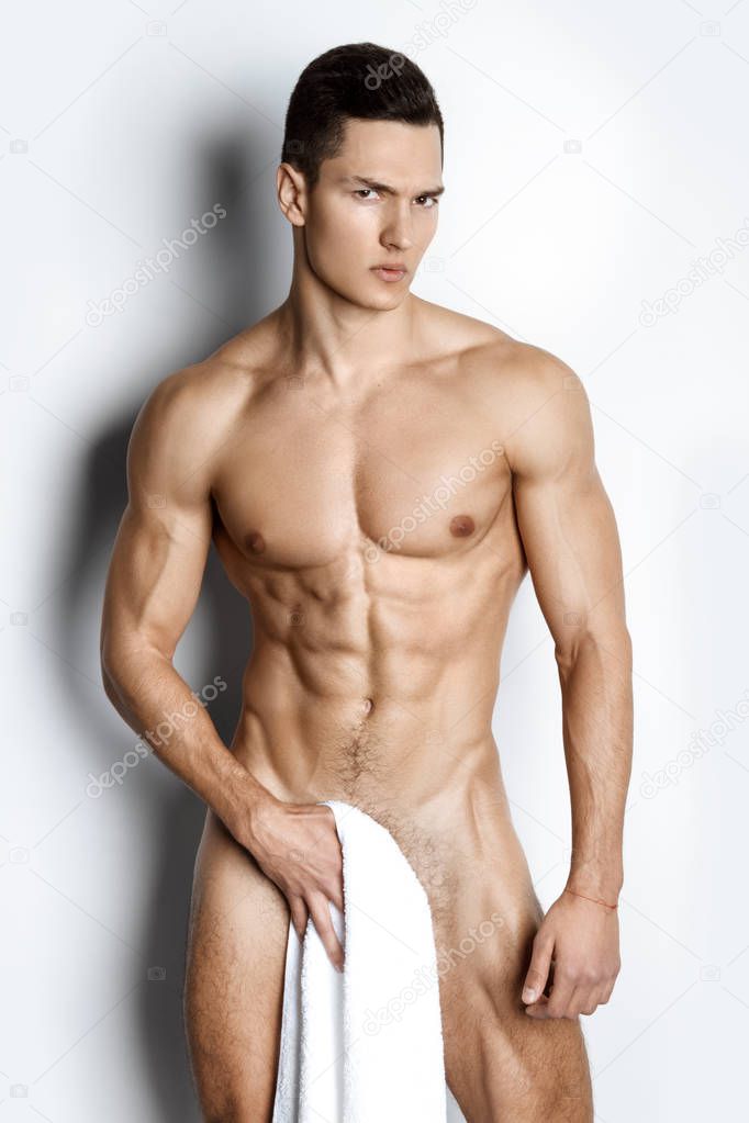 Guy with white towel on white background