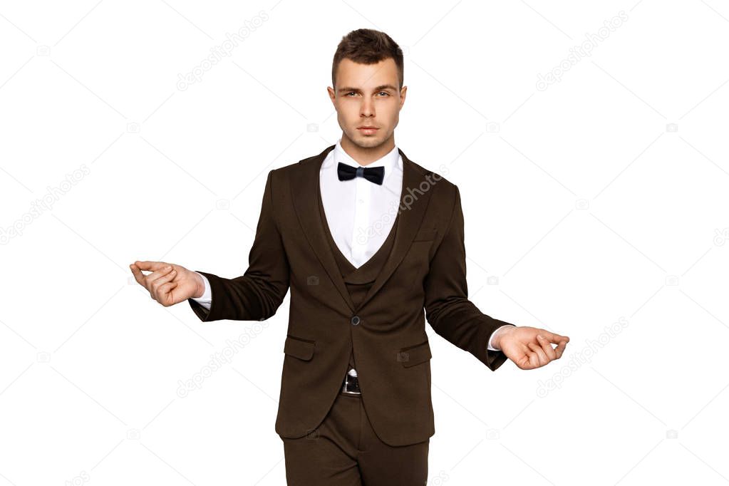 Man in suit and vest in white shirt on white background