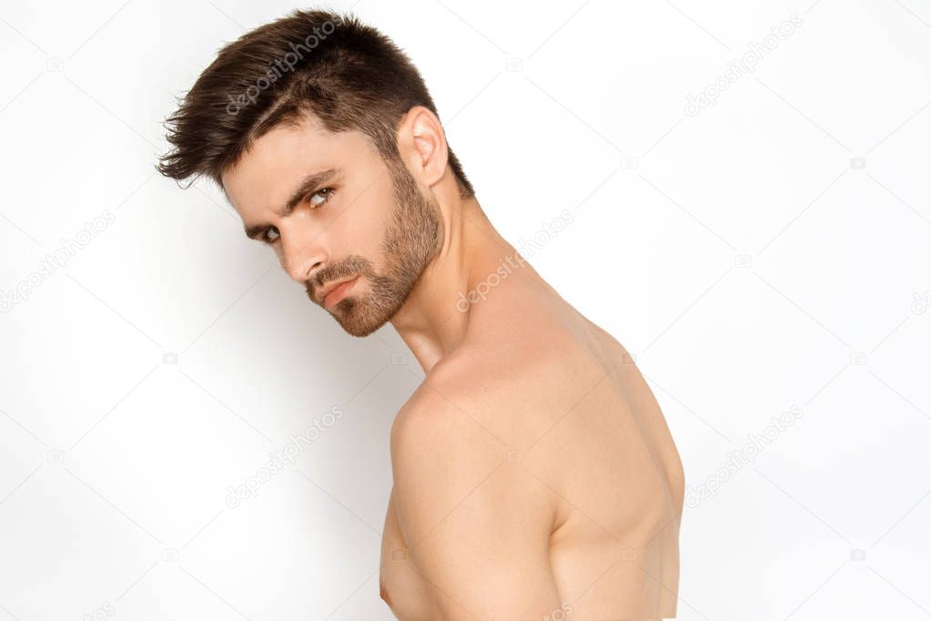 Stripped strong face guy in black underwear on white background in studio isolated