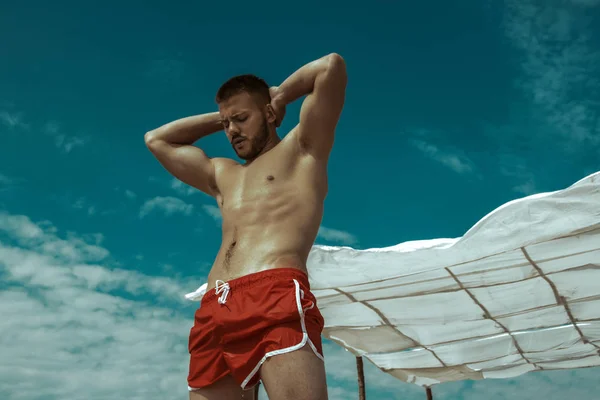 Sexy Strong Bearded Male Hunk Red Swim Shorts Water Background — Stock Photo, Image