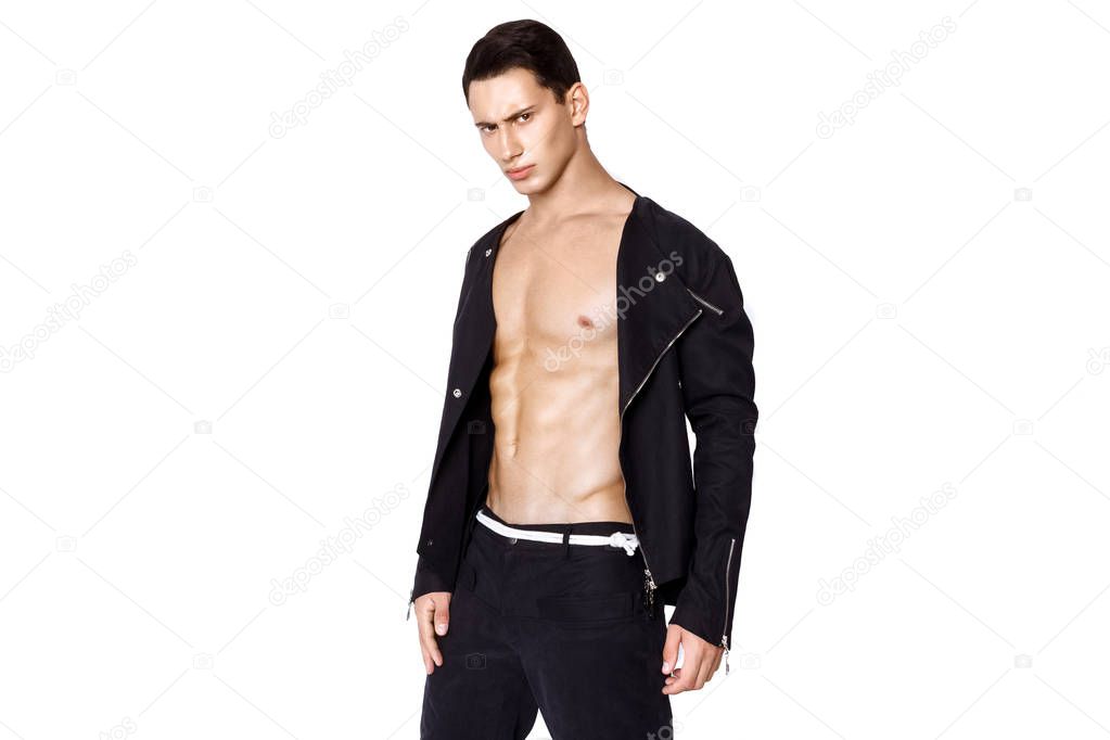 Strong muscle beautiful stripped male model in fashion casual cloathes on white isolated fontk background