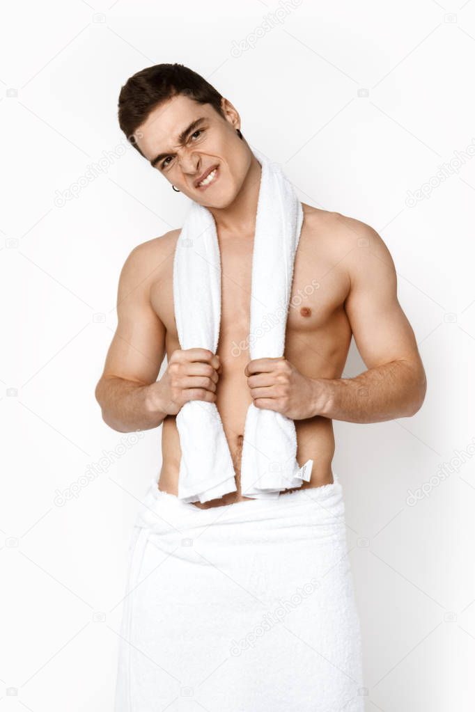 Sexy sport muscle strongface guy with white towel on white isolated white font background