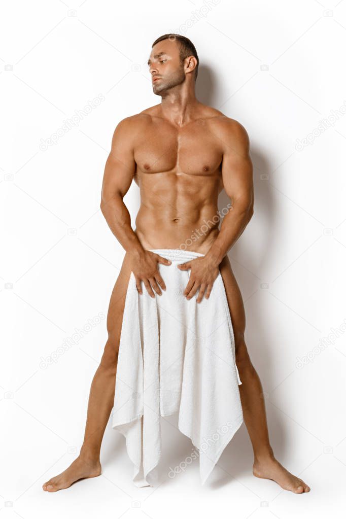 Sexy sport muscle guy with white towel on white isolated font background