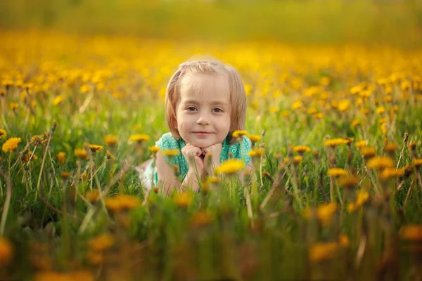 Cute Little Girl Lying Yellow Dandelion Meadow Summer Day — Stock Photo, Image