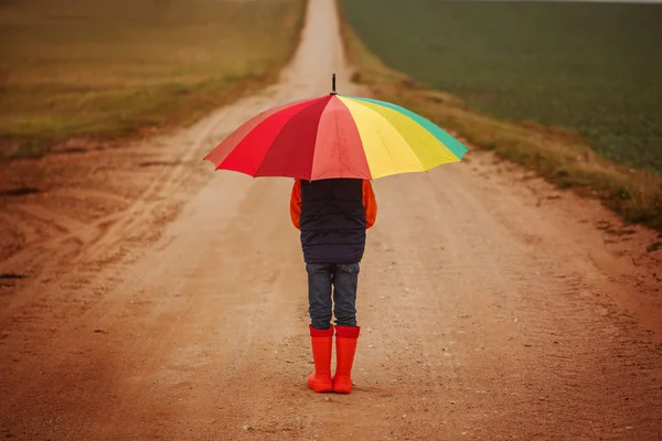 Child Orange Rubber Boots Holding Colorful Umbrella Rain Autumn Back — Stock Photo, Image