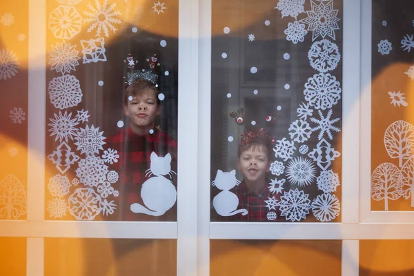Two Adorable Brothers Looking Window Waiting Holidays Decoration Snowflakes Paper — Stock Photo, Image