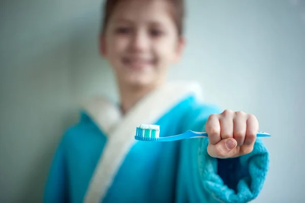 Child brushing teeth. Focus on Kids tooth brush and paste. — Stock Photo, Image