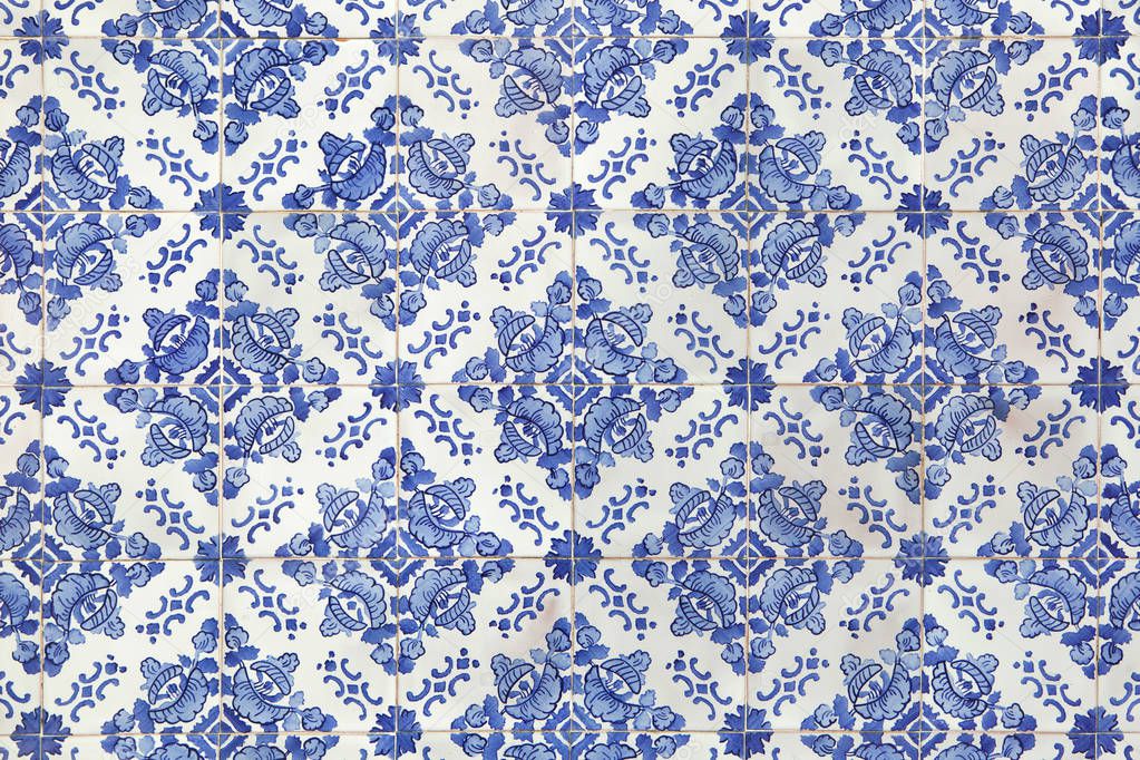 Traditional Portuguese azulejo tiles on the building in Porto, Portugal. Background texture. 