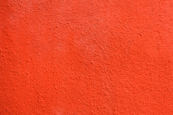 Bright orange painted stucco wall background