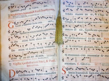 Gregorian style ancient music sheet detail view clipart