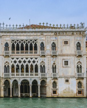 VENICE, ITALY, JANUARY - 2018 - Famous venetian gothic style palace at grand canal of venice city. clipart