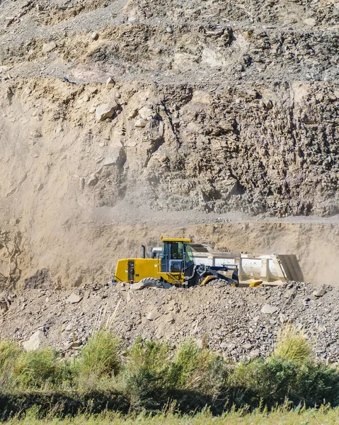 Trucks at highway construction at rocky landscape, san juan province, Argentina