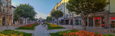 Braga, Portugal: August 14 2023: A wide panoramic shot of a beautiful pedestrian avenue, Avenida da Liberdade, in the center of Braga, Portugal. 