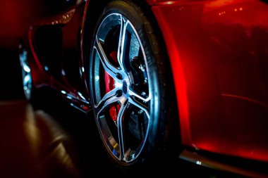 Close Up on beautiful modern supercar with dramatic lighting