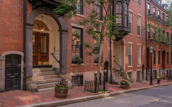 Acorn Street in Beacon Hill district, Boston, Massachusetts, USA - July 28, 2018: Entries of mansions in the Beacon Hill district in the city of Boston