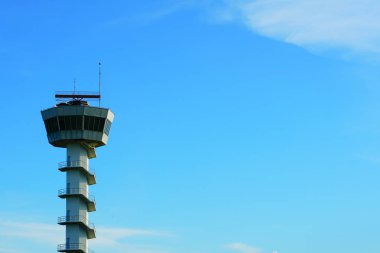 AERONAUTICAL Radio`s high sky tower at airport location on blue sky background symbol object communication. clipart