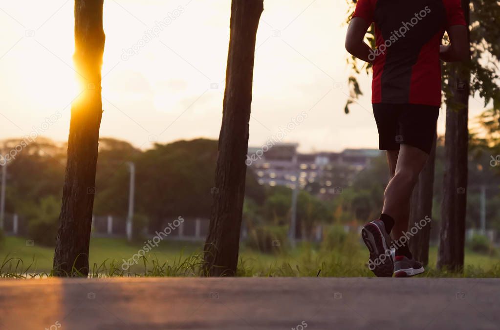 Young man run on street, Runner jogger at city park with exercise fitness dark black color.