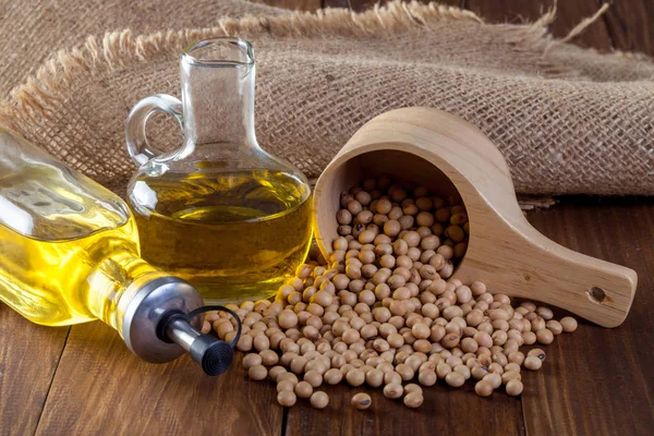 Soybean oil and Soybean on wooden